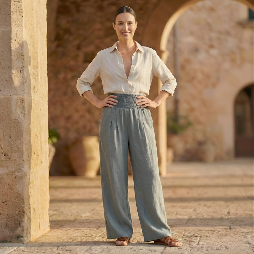 FJØRNA high waist wide leg white trousers for women, stylish and flowy pants with a relaxed fit and tailored waistband.