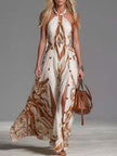 FJØRNA Off-White chiffon halter neck maxi dress with flowing fabric and casual style, suitable for warm weather occasions.