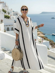 FJØRNA women's summer maxi dress with blue and white stripes, short sleeves, flowy lightweight fabric, perfect for warm weather.
