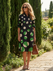 FJØRNA women's summer dress with polka dots, wrap style, flowy and breathable fabric, perfect for warm weather.