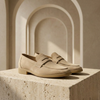 FJØRNA men's suede slip-on loafers showing a close-up of tan suede shoes with a sleek design and comfortable fit.