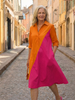 FJØRNA women's summer wrap dress in flowy fabric, stylish and comfortable for warm weather, shown in a natural pose.