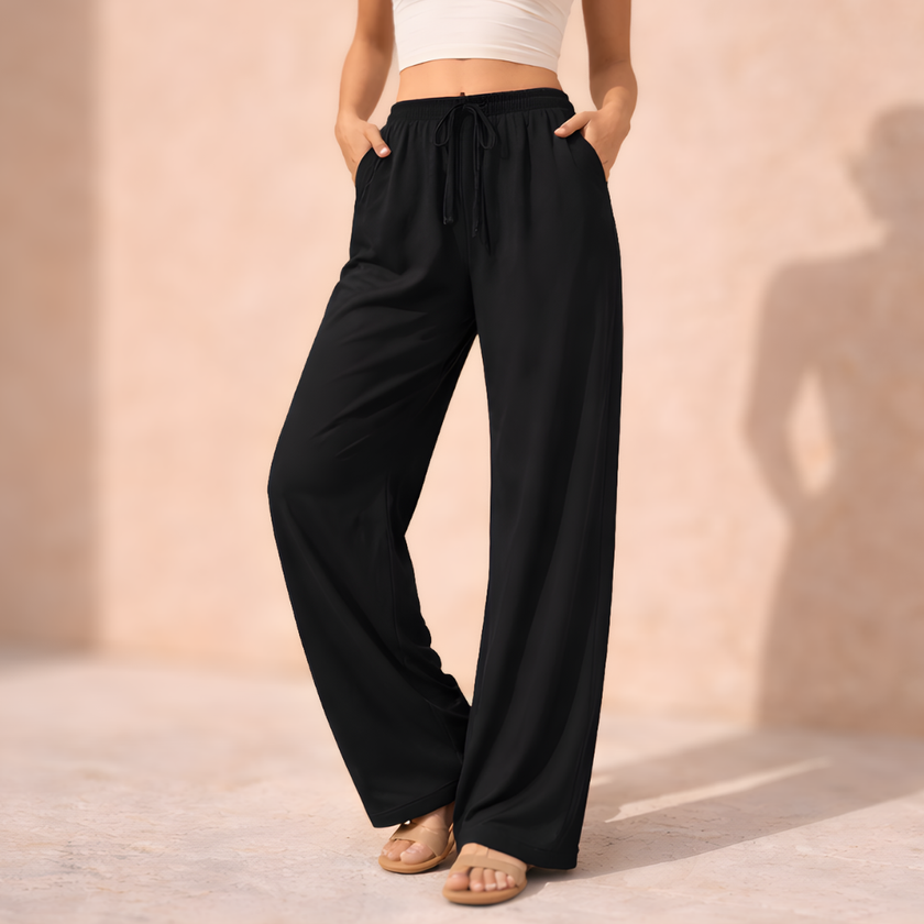 FJØRNA women's wide-leg drawstring lounge trousers, loose pull-on pants in soft fabric, relaxed fit, comfortable casual wear.