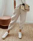 FJØRNA lightweight summer women's trousers with straight leg cut and high waist, shown in soft fabric on a model.