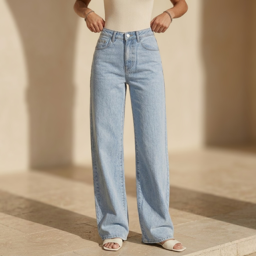 Women’s high waisted wide leg denim jeans by FJØRNA, showing the relaxed fit and stylish wide leg design in a front view.