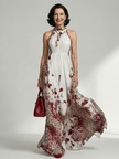 FJØRNA women's floral summer maxi dress with V-neck and long sleeves, flowing lightweight fabric perfect for warm weather.