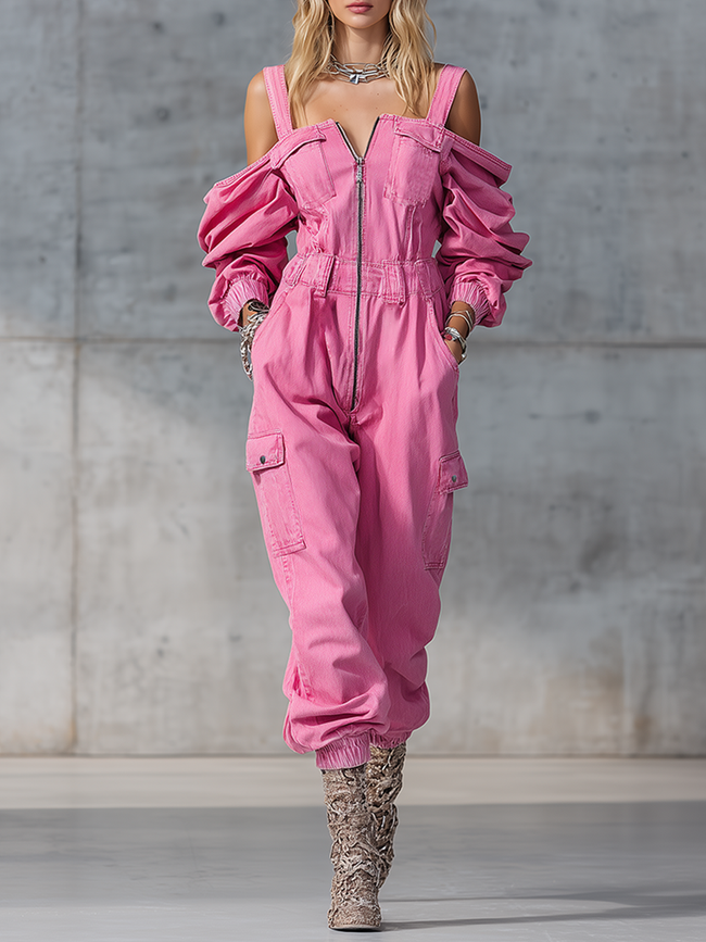 Pink denim strappy tapered long sleeve jumpsuit for women by FJØRNA, featuring a fitted waist and stylish long sleeves.