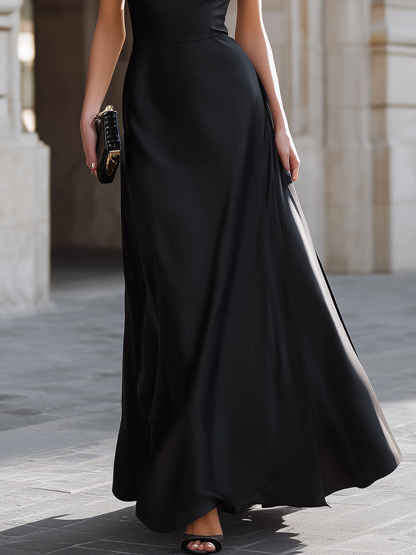 Black one-shoulder draped high-neck maxi dress by FJØRNA featuring elegant design and flowing fabric.