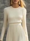 Cream satin pleated maxi dress by FJØRNA featuring a flowing design and elegant pleats, perfect for casual occasions.