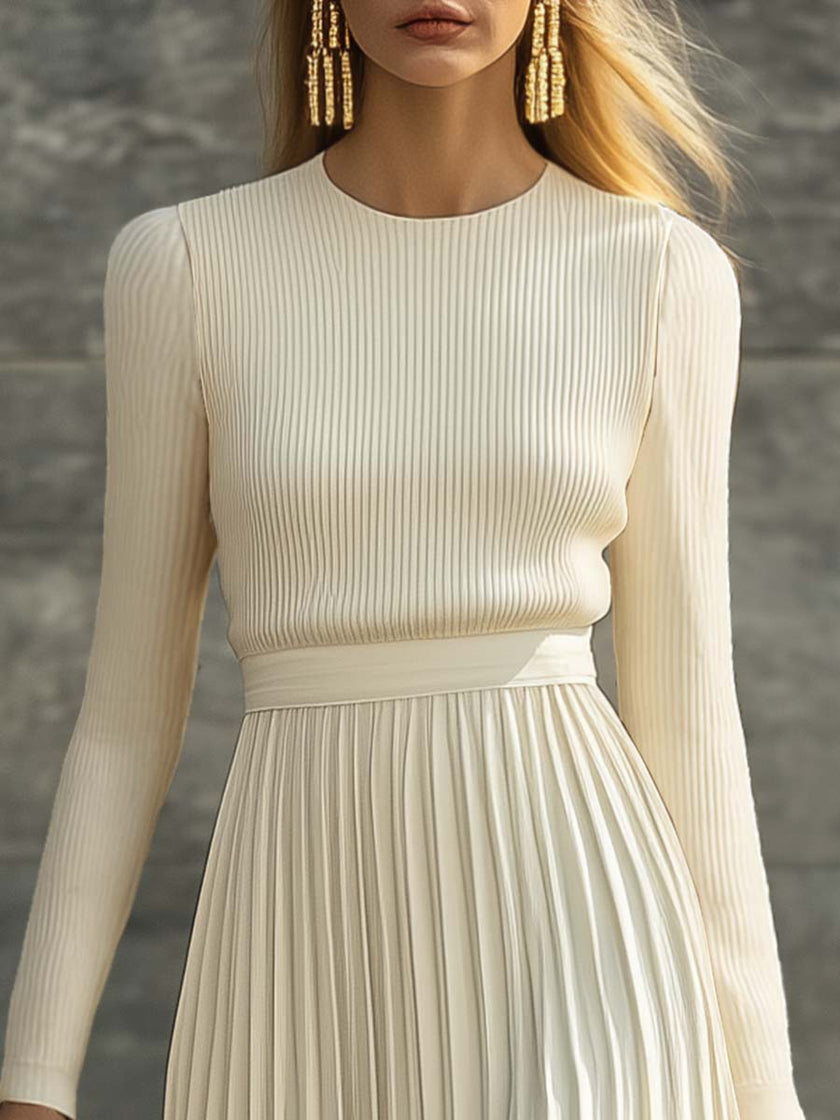 Cream satin pleated maxi dress by FJØRNA featuring a flowing design and elegant pleats, perfect for casual occasions.