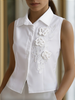 White sleeveless floral embroidery blouse for women by FJØRNA, featuring delicate floral details and a stylish sleeveless design.