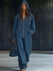 FJØRNA casual loose retro denim jumpsuit with long sleeves, hood, zipper, and pockets, designed for women.