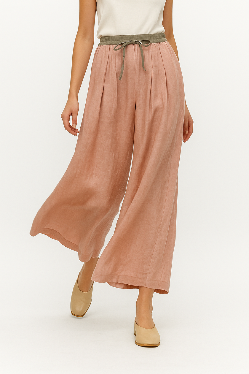 FJØRNA women's linen tapered trousers, stylish and lightweight pants, with a relaxed fit and natural fabric texture.