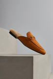 FJØRNA women's plush fur-lined slip-on mule slippers with elegant design and comfortable plush interior.