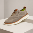 Men's FJØRNA breathable knit mesh trainers with cushioned waffle-pod sole, showcasing lightweight, minimalist athletic shoe design.