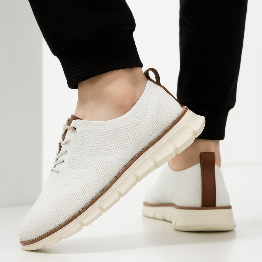 Men's white breathable knit mesh trainers by FJØRNA with cushioned waffle-pod sole and sleek athletic design.