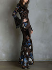FJØRNA velvet floral evening dress with elegant design, featuring a fitted bodice and flowing skirt for formal occasions.