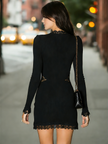 Black lace bodycon dress by FJØRNA, close-up of fitted evening dress with intricate lace details and elegant silhouette.