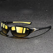 FJØRNA men's polarized wraparound UV400 sports sunglasses with sleek black frame and tinted lenses for outdoor activity.