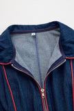 Dark blue FJØRNA denim wide-leg jumpsuit with topstitch details, long sleeves, and a relaxed fit for women.