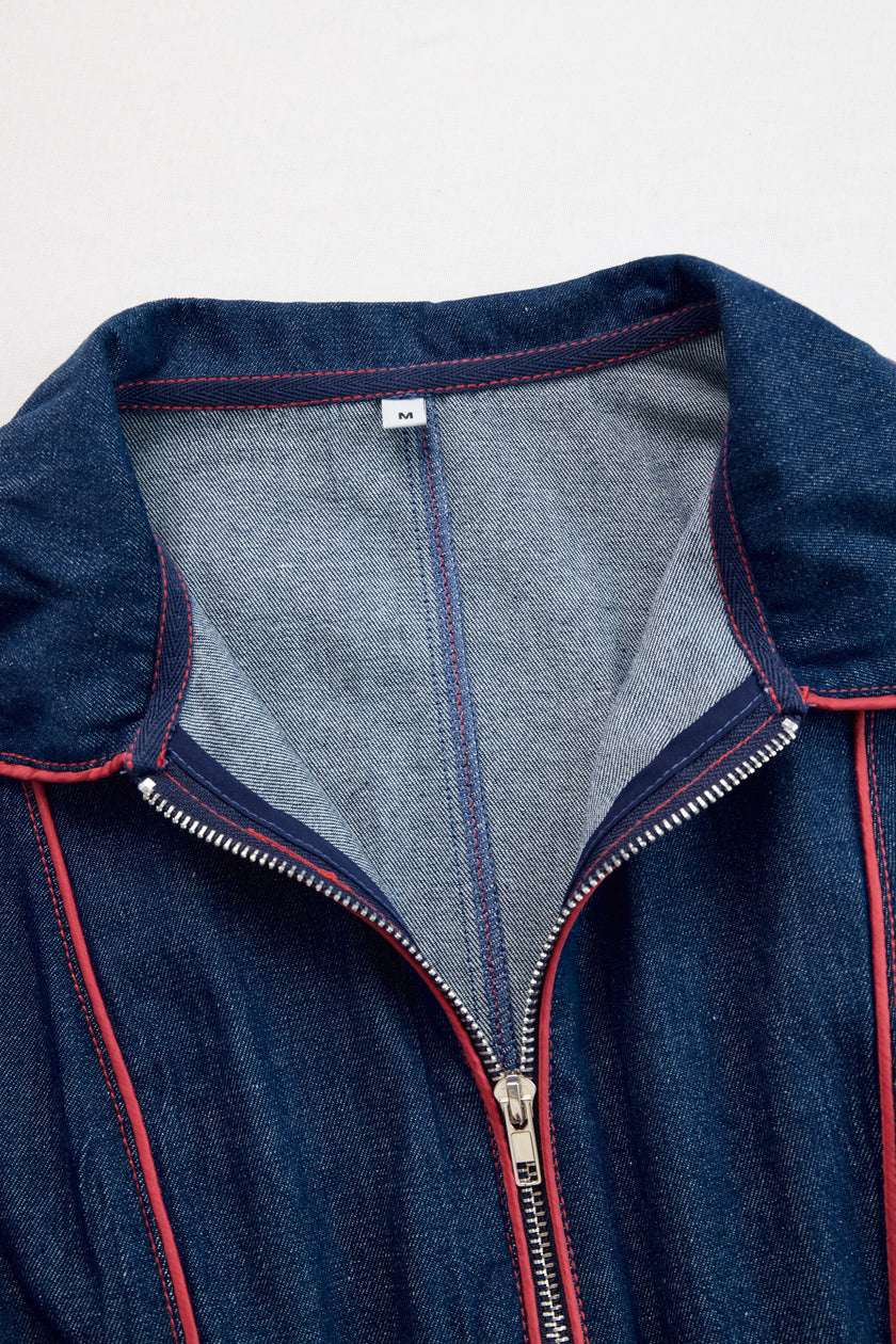Dark blue FJØRNA denim wide-leg jumpsuit with topstitch details, long sleeves, and a relaxed fit for women.
