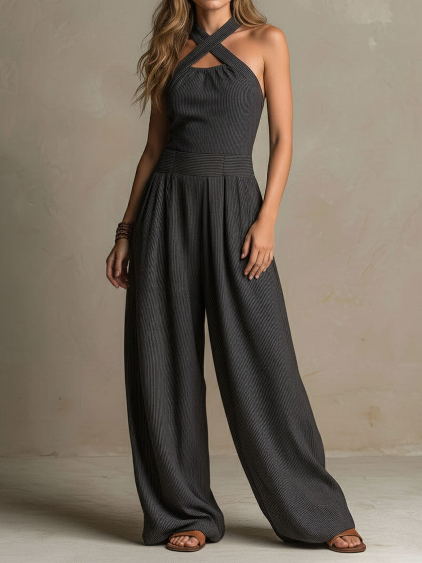 FJØRNA charcoal pinstripe halter neck wide-leg women's jumpsuit with tailored pants and a stylish halter top design.