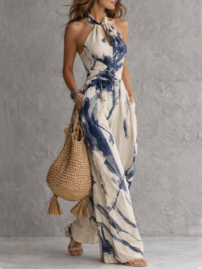 White ink wash print halter neck wide-leg women's jumpsuit with pockets by FJØRNA, featuring a stylish and comfortable design.