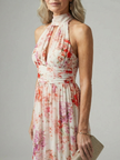 FJØRNA women's summer maxi dress with floral pattern, halter neck, sleeveless, flowy design, perfect for warm weather.