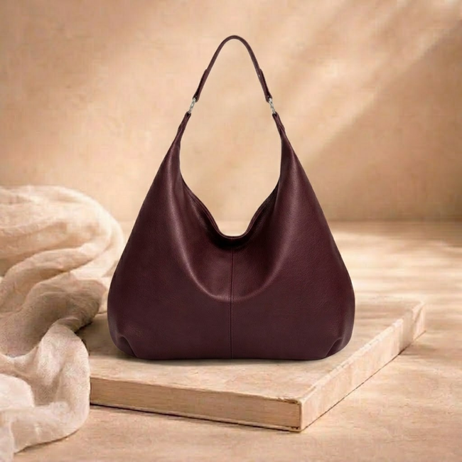 Large leather hobo bag for women by FJØRNA, featuring a spacious design with top handles, casual style, and soft brown leather.