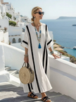 FJØRNA women's summer maxi dress with striped pattern, short sleeves, flowy lightweight fabric, perfect for warm weather.