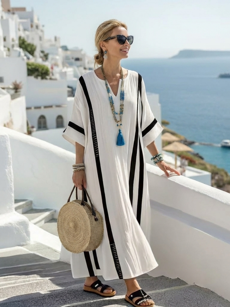 FJØRNA women's summer maxi dress with striped pattern, short sleeves, flowy lightweight fabric, perfect for warm weather.