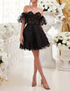 Black tulle cocktail dress for women with floral puff sleeves by FJØRNA, showcasing elegant design and delicate fabric details.