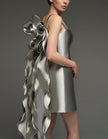 Silver satin cocktail dress for women by FJØRNA featuring a square neckline, bodycon fit, and cape-style strappy design.