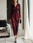 Burgundy satin midi dress for women with V-neck, mermaid silhouette, long sleeves, by FJØRNA, displayed on a hanger.