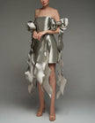 Silver satin cocktail dress by FJØRNA with square neckline, strappy details, and cape-style bodycon fit for women.