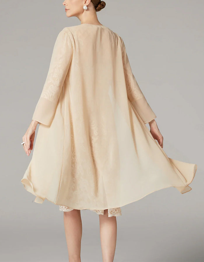 FJØRNA apricot chiffon mini dress for women with long sleeves and embroidered details, bodycon fit, perfect for elegant occasions