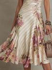 FJØRNA chiffon floral midi dress for evening wear, featuring a flowy silhouette and vibrant floral pattern.