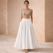 White high-waist A-line maxi skirt for women, stylish and flowing, by FJØRNA, featured on a model wearing it as a skirt.