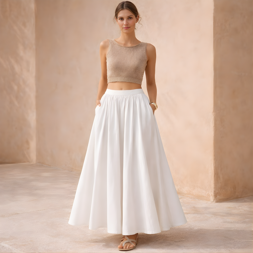 White high-waist A-line maxi skirt for women, stylish and flowing, by FJØRNA, featured on a model wearing it as a skirt.