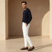 Men's slim fit ankle-length chinos by FJØRNA, shown in a neutral color, tailored for a sleek, modern look.