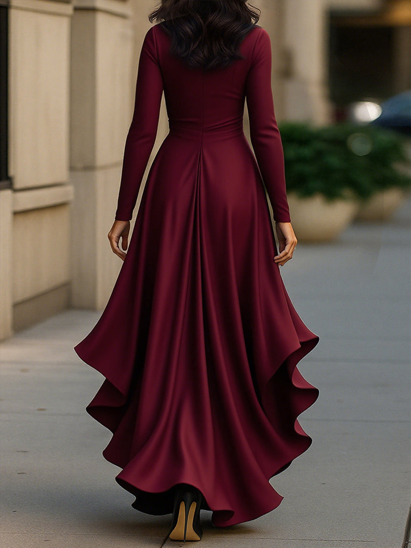 Navy blue satin maxi dress with draped design and ruffle details by FJØRNA, featuring a flowing silhouette and elegant style.