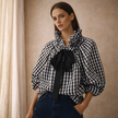FJØRNA women's oversized gingham ruffle long sleeve blouse, lightweight tops with a relaxed fit and feminine ruffle details.