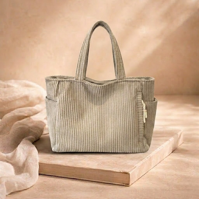 Large corduroy tote bag for women by FJØRNA, featuring a spacious shoulder design perfect for everyday use.