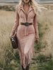 Pink tassel midi dress by FJØRNA, featuring a casual style with flowing fabric and tassel details, worn in a relaxed setting.