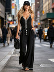 FJØRNA black color-block V-neck sleeveless button-down jumpsuit with pants, stylish and modern for women.