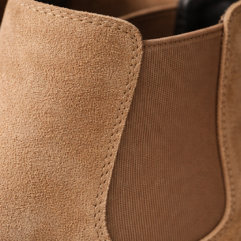 FJØRNA black slip-on Chelsea boots for men, stylish leather shoes with elastic side panels and sleek design.