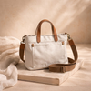 Large FJØRNA canvas messenger bag with adjustable shoulder strap, casual everyday bag for women, featuring front flap and spacious interior.