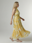 FJØRNA women's summer midi dress with halter neck, sleeveless and casual style, shown on a model in a bright outdoor setting.