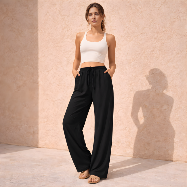 FJØRNA women’s wide-leg drawstring lounge trousers with loose fit and pull-on design, perfect for comfortable casual wear.