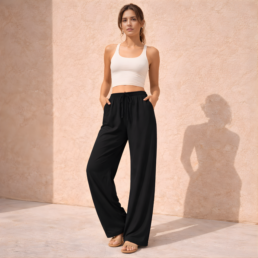 FJØRNA women’s wide-leg drawstring lounge trousers with loose fit and pull-on design, perfect for comfortable casual wear.